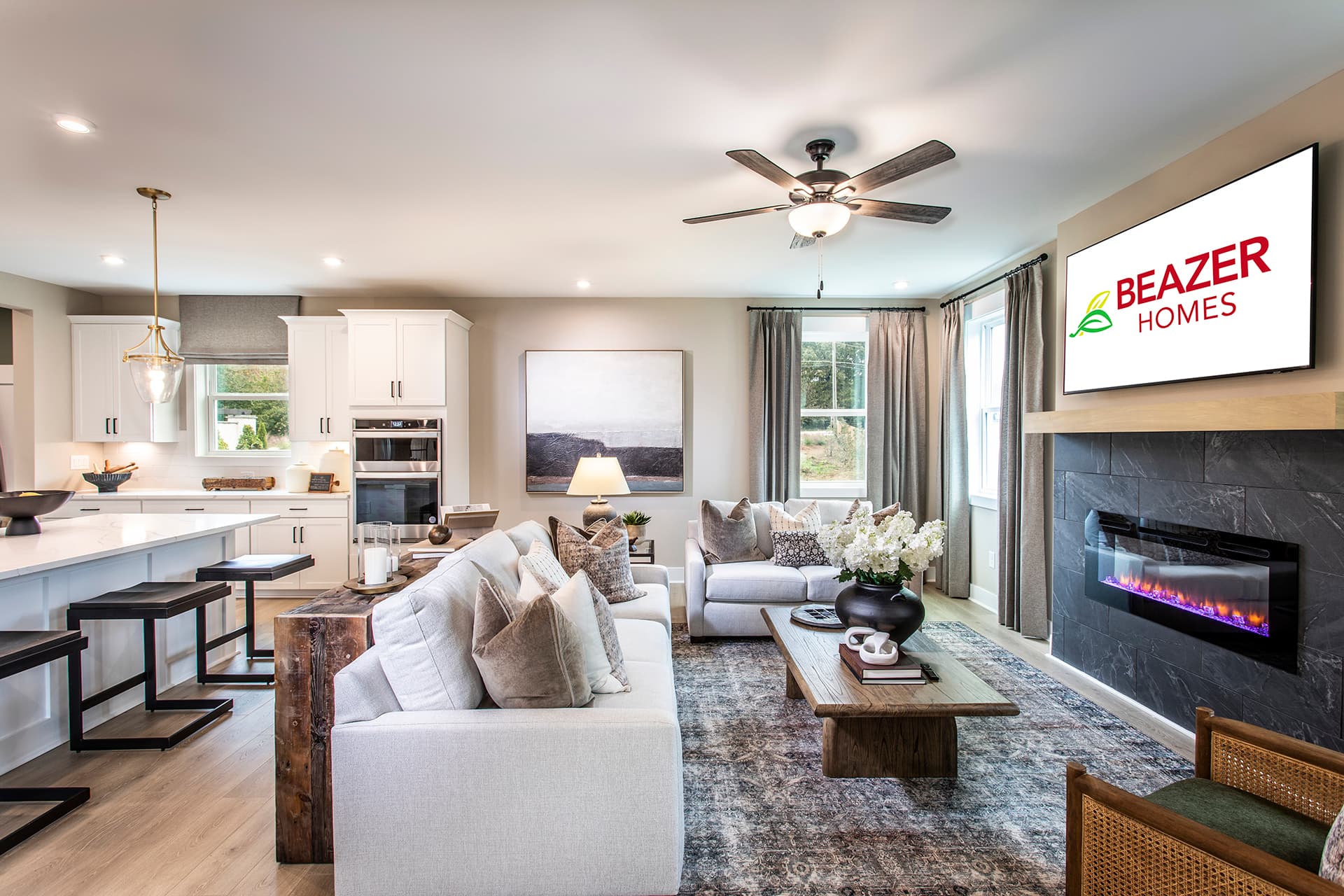 great room with electric fireplace & light floors