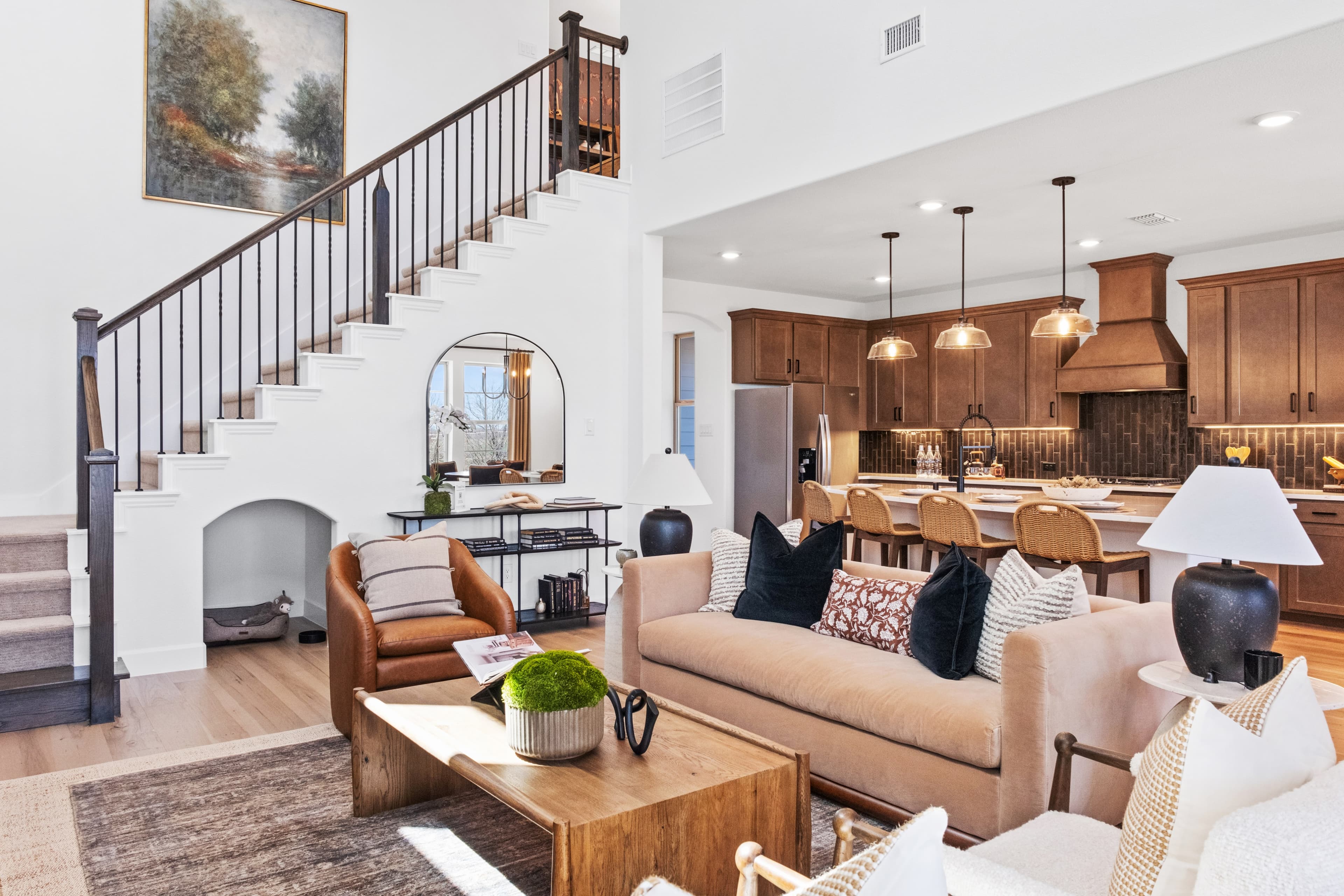 great room with wood floors and tall ceilings 
