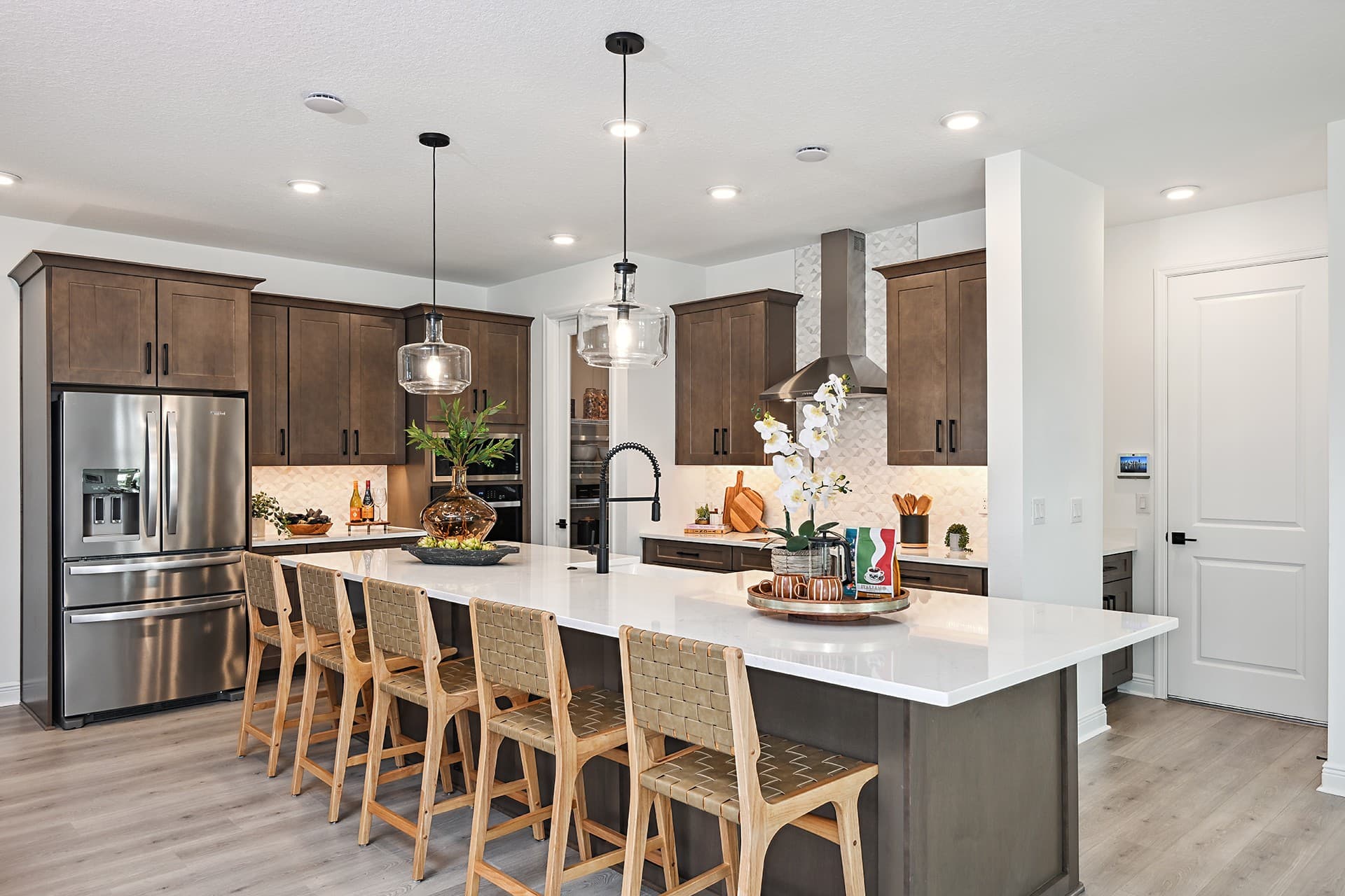 kitchen with brown cabinets and quartz countertops