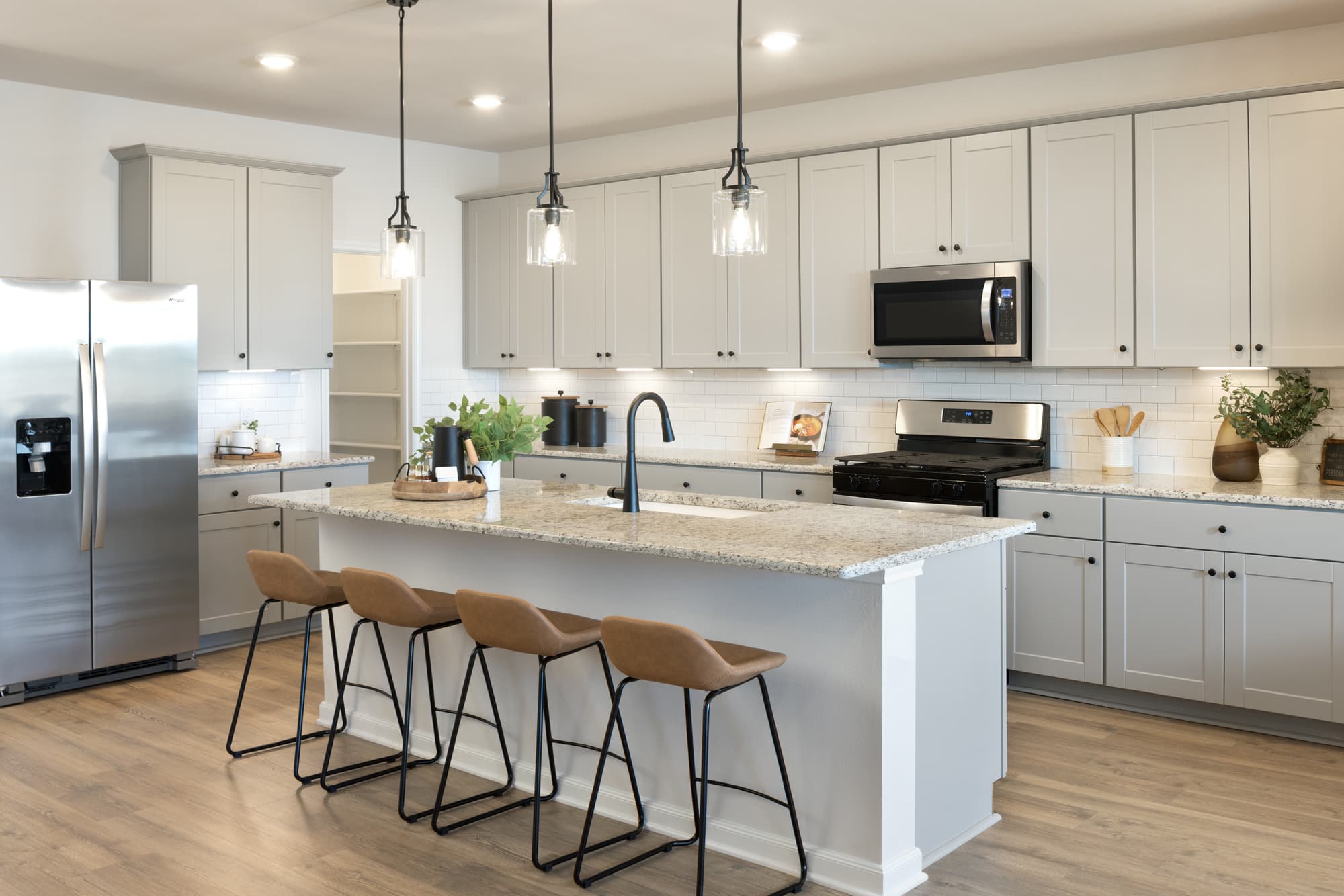 kitchen with granite countertops & gray cabinets 