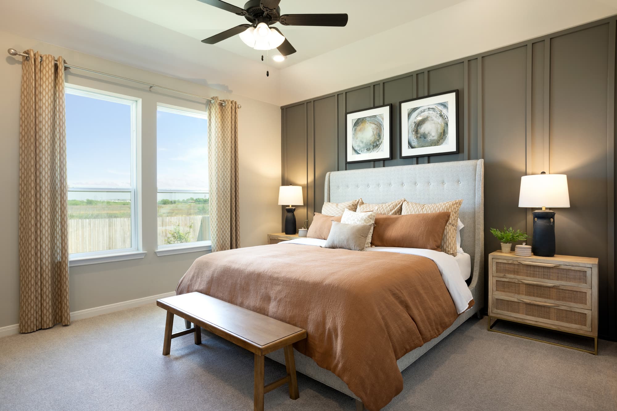 bedroom with accent wall, pictures & nightstands