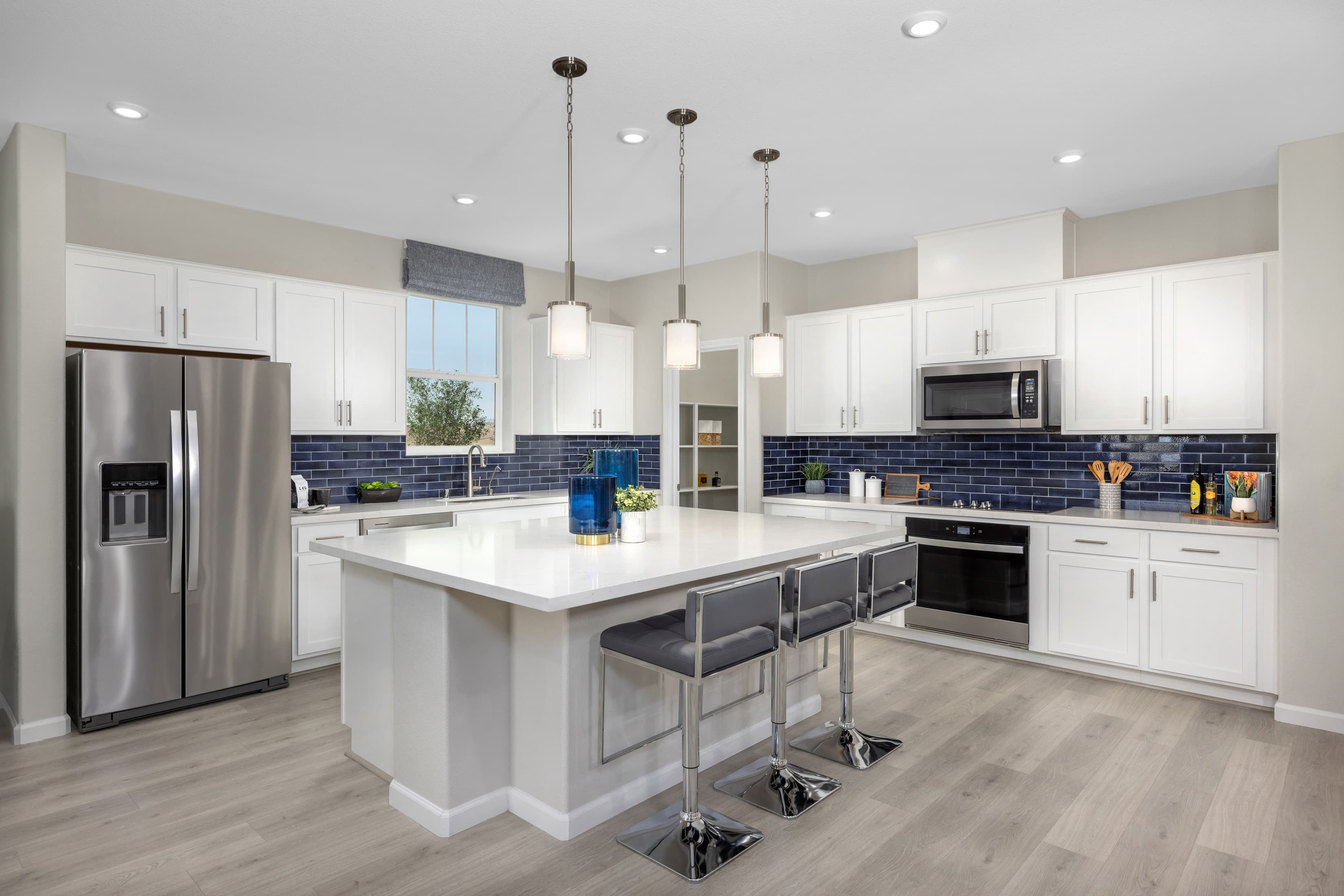 open and airy kitchen with white cabinets