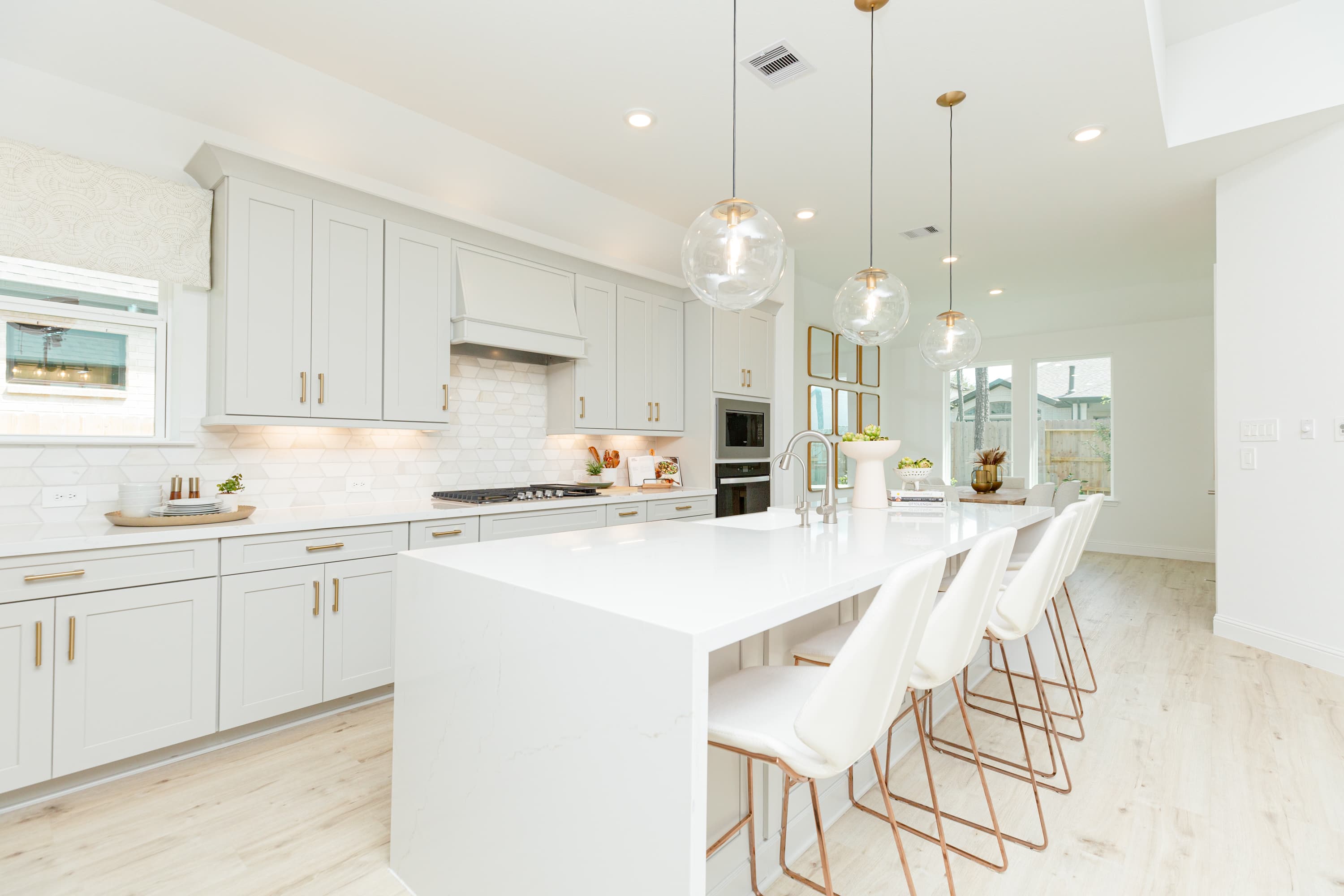gray and white kitchen with oversized island