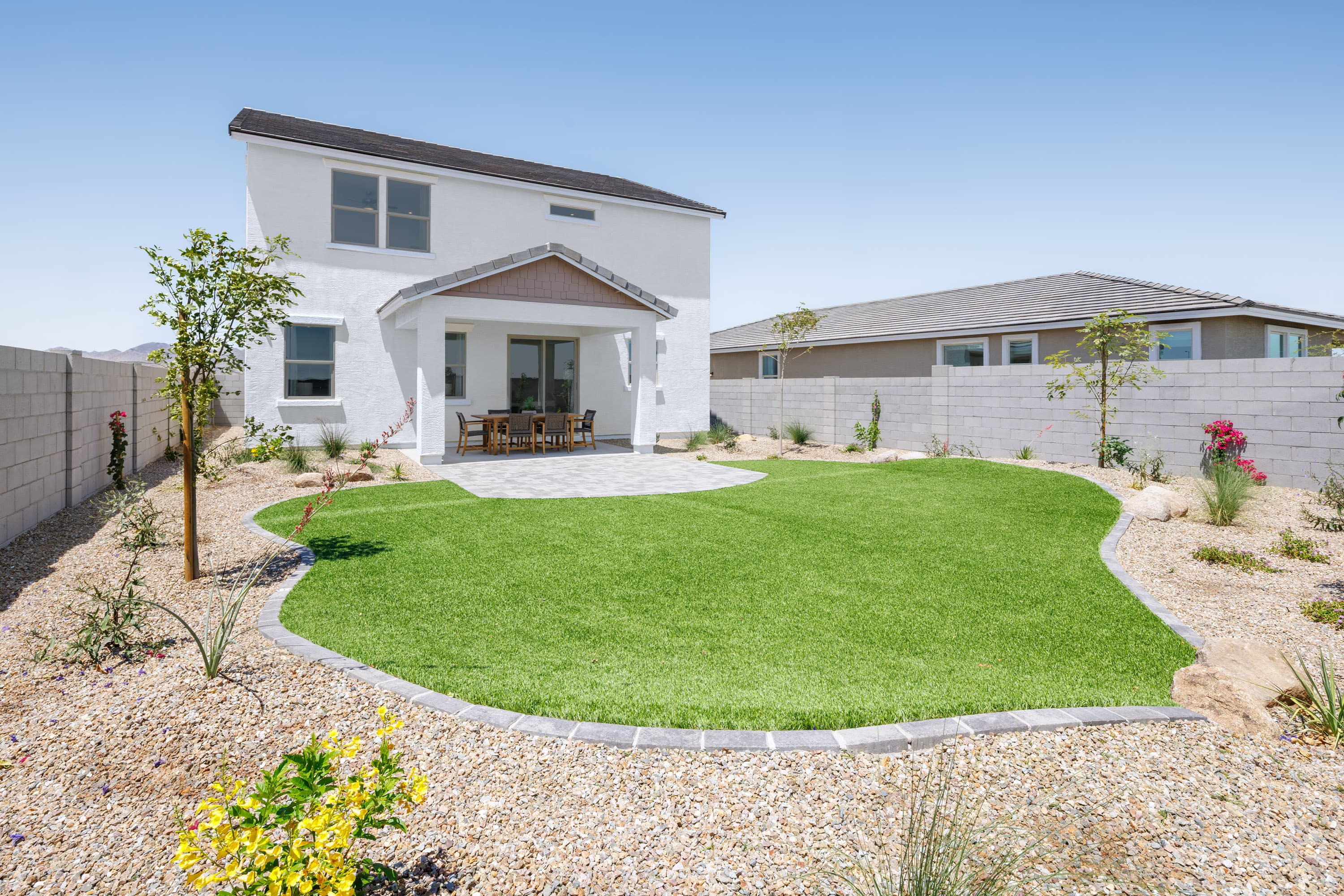 spacious backyard with artificial grass