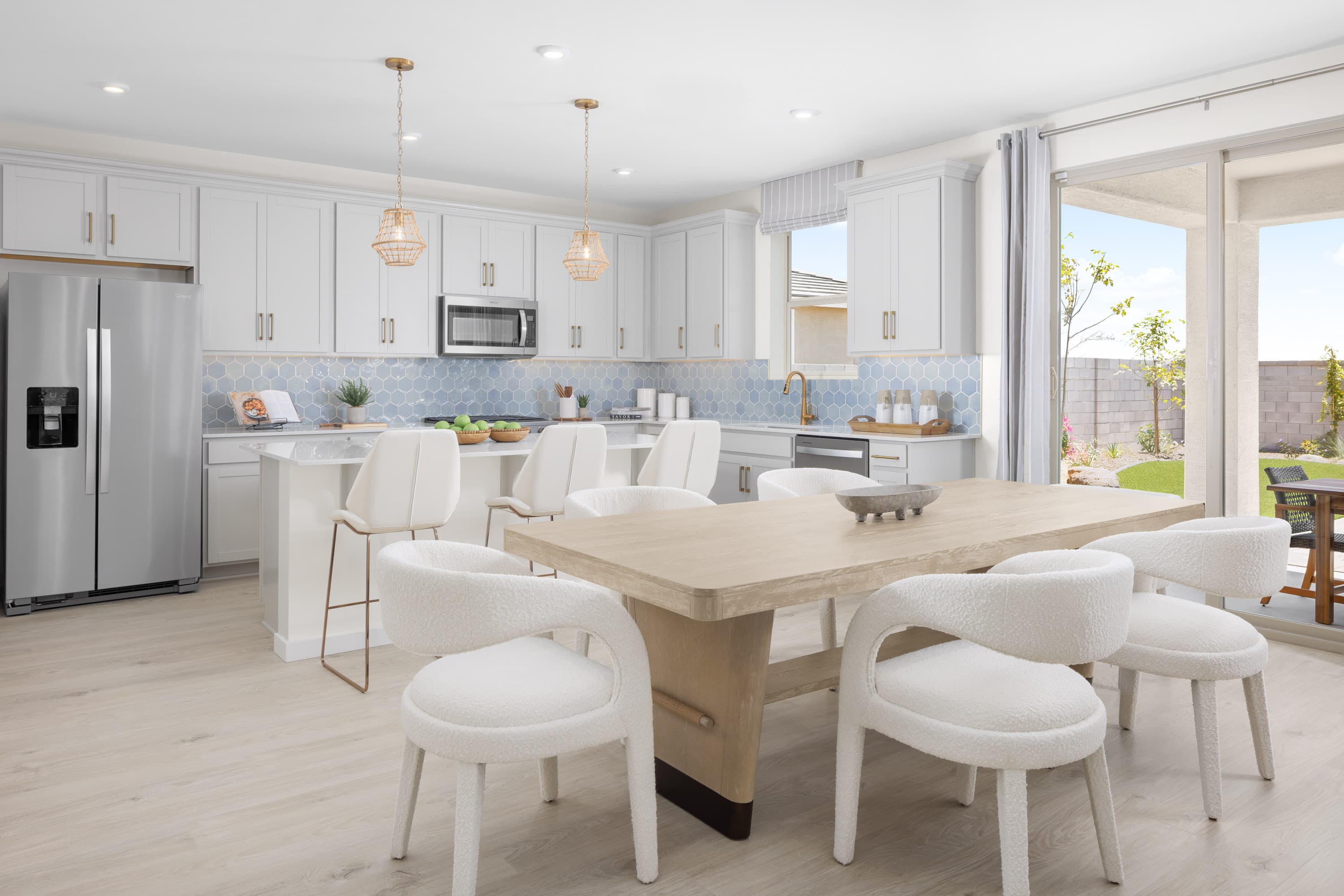 wooden dining table with white chairs