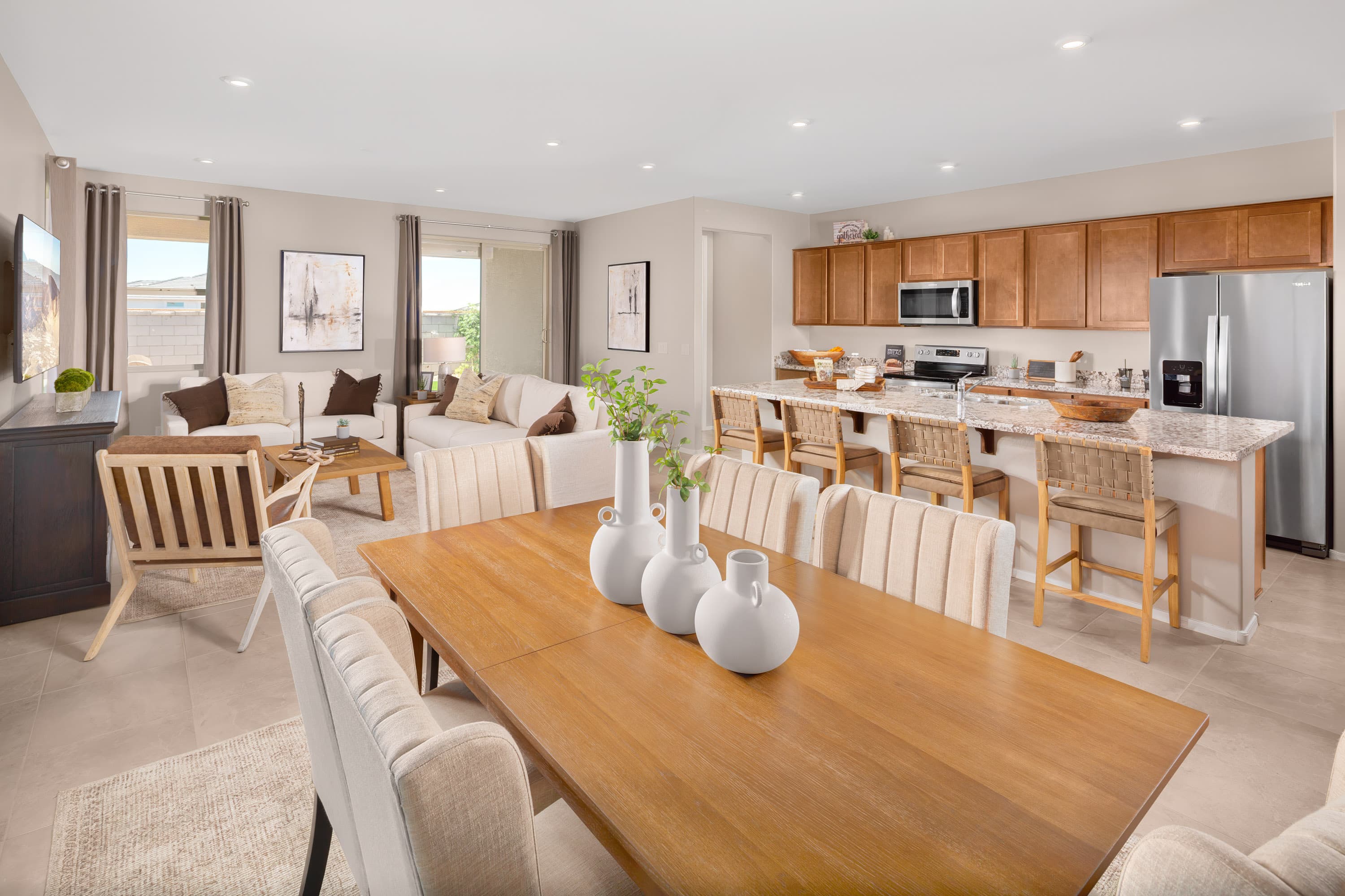 open-concept dining and living area with chairs