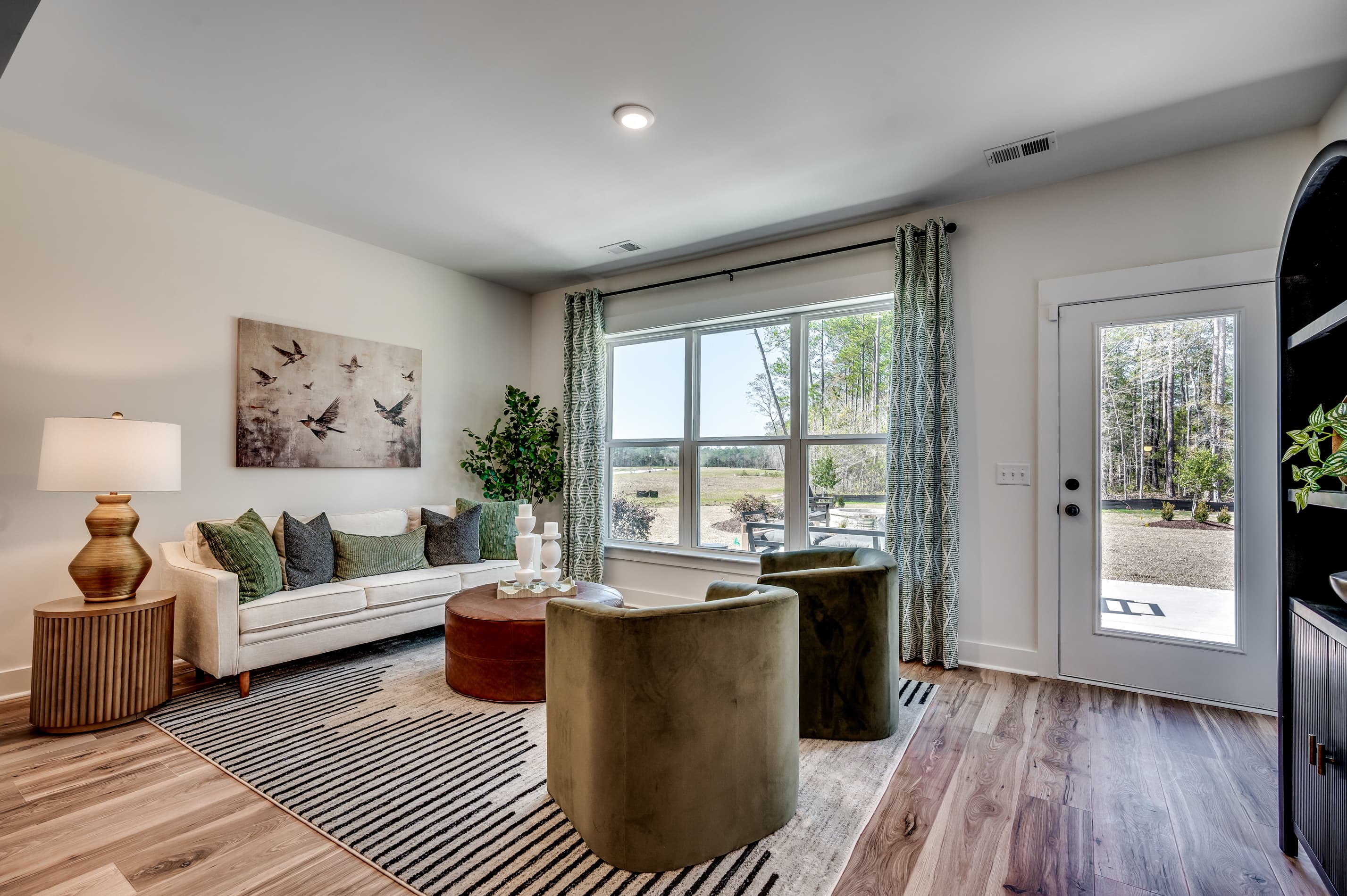 large windows and hardwood flooring 