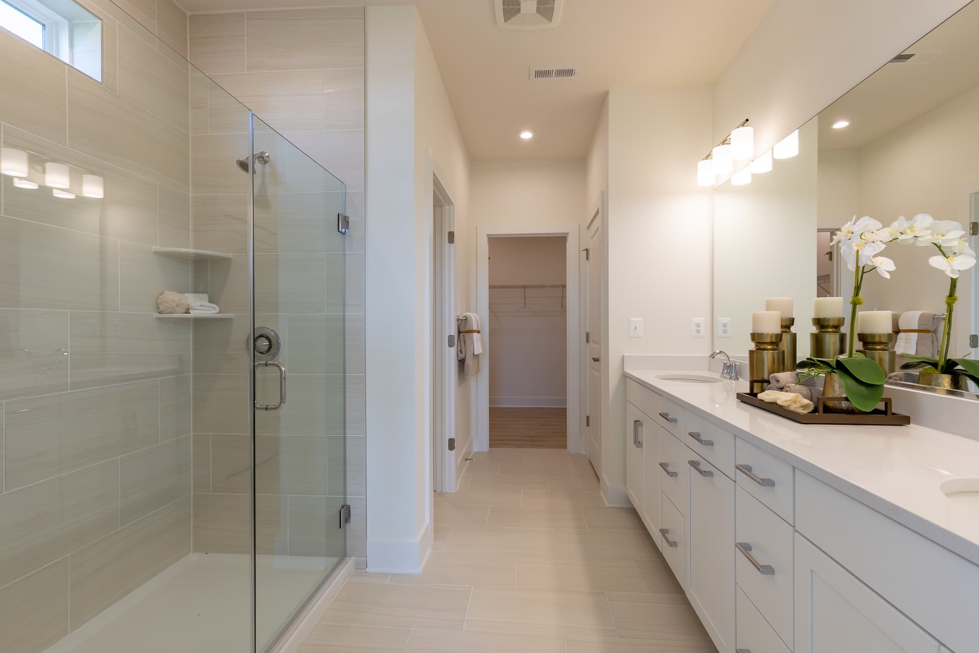 primary bath featuring dual vanities