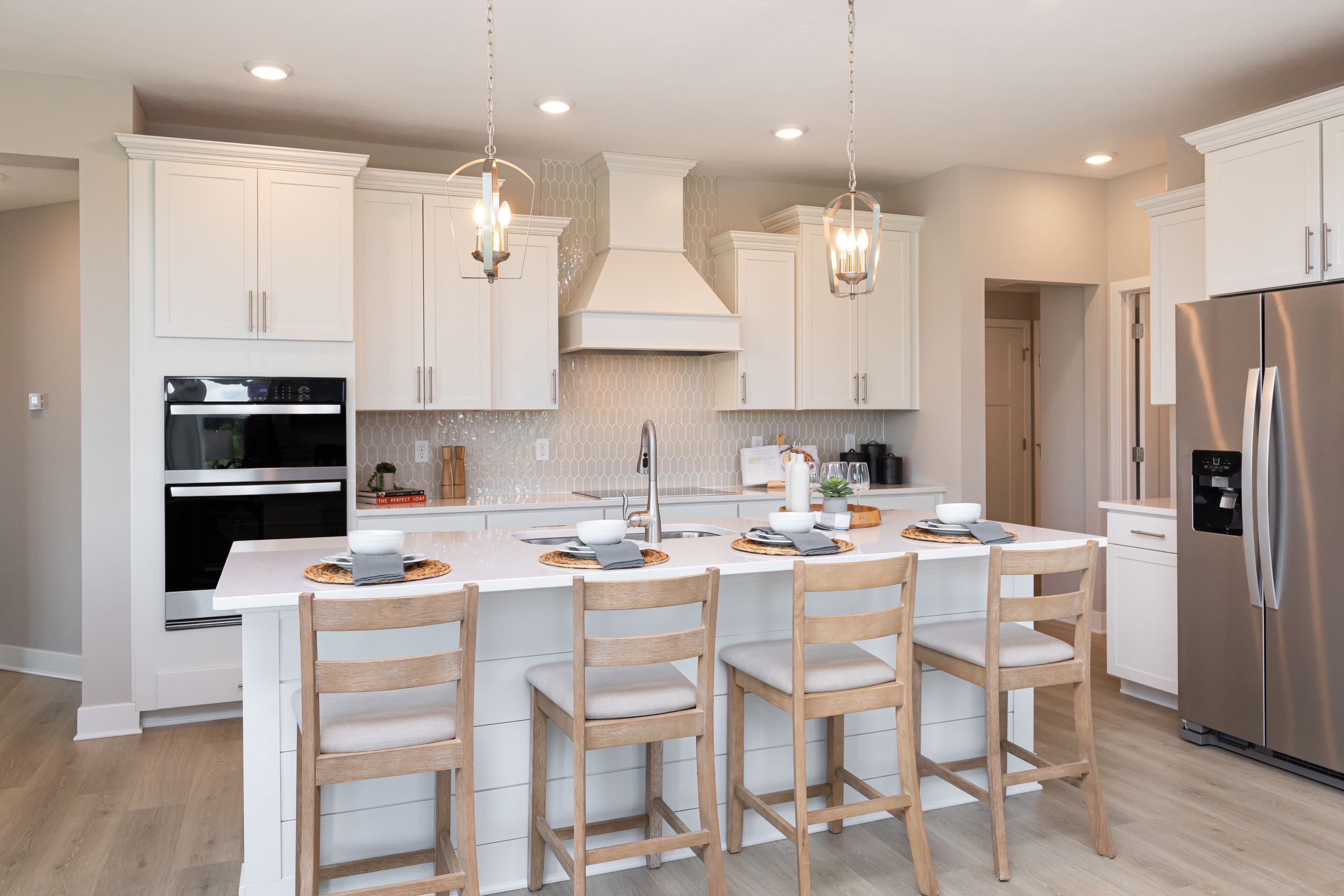 kitchen with white cabinets and tile backsplash