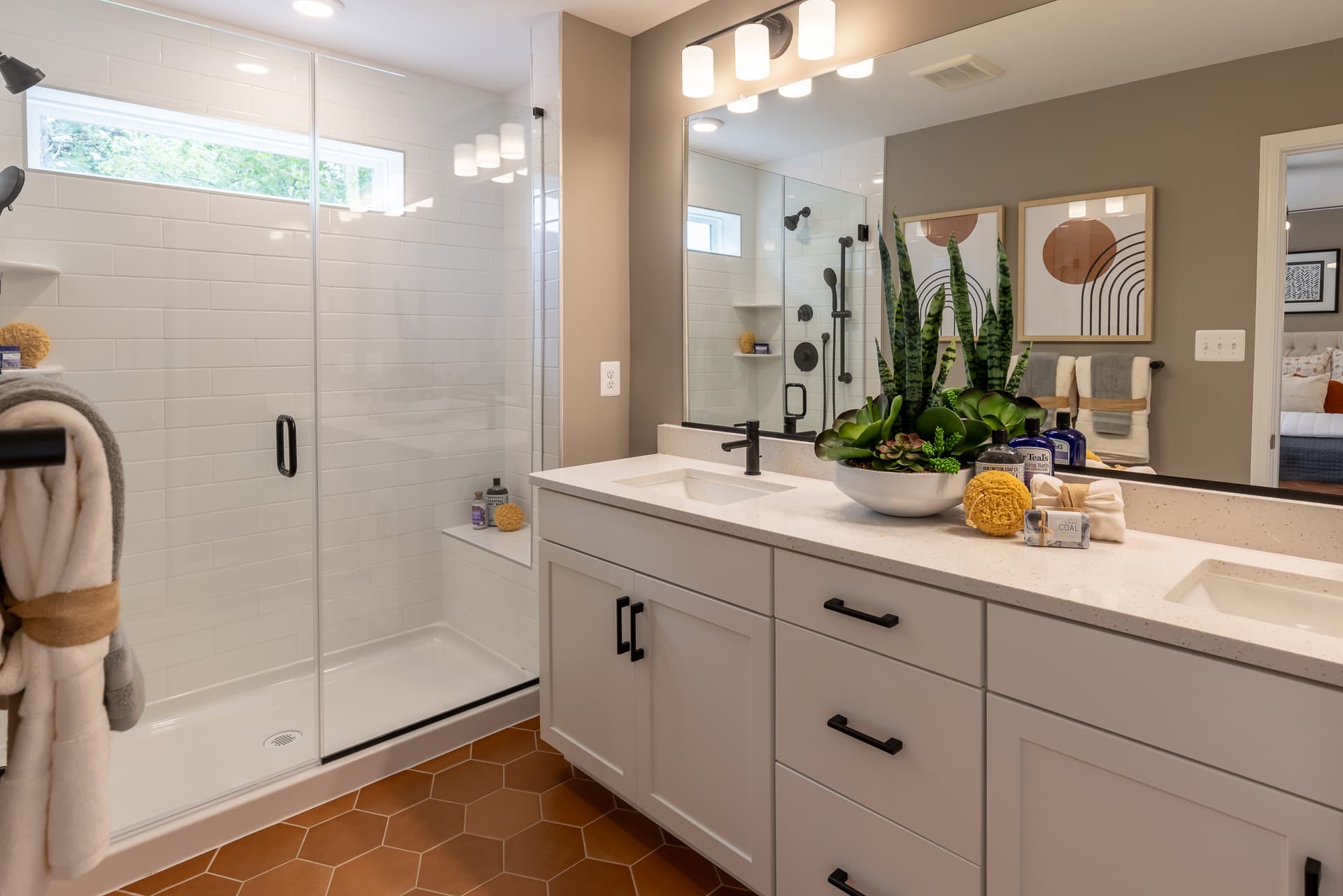 primary bath with copper colored designer flooring