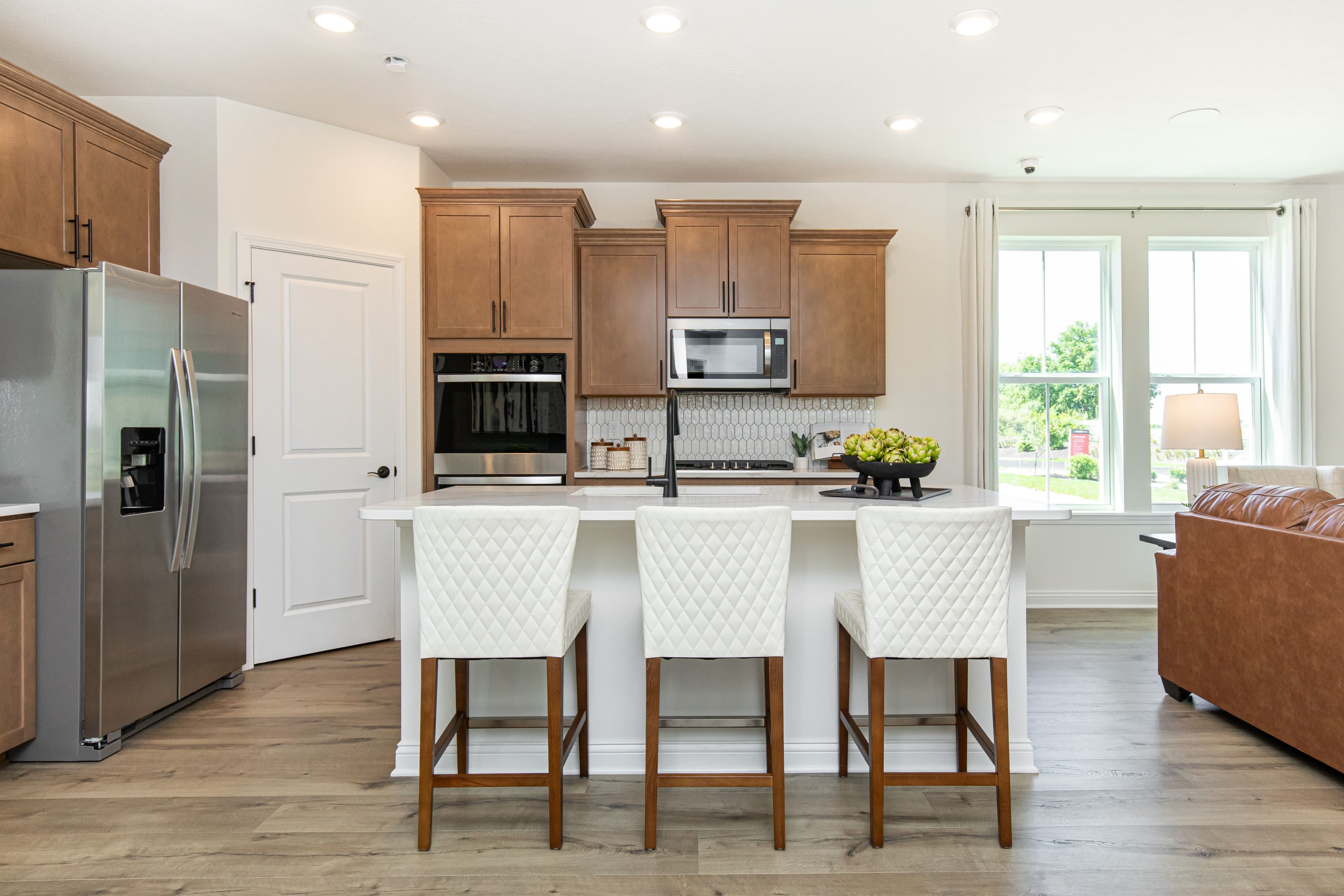 kitchen with spacious island and bar stools