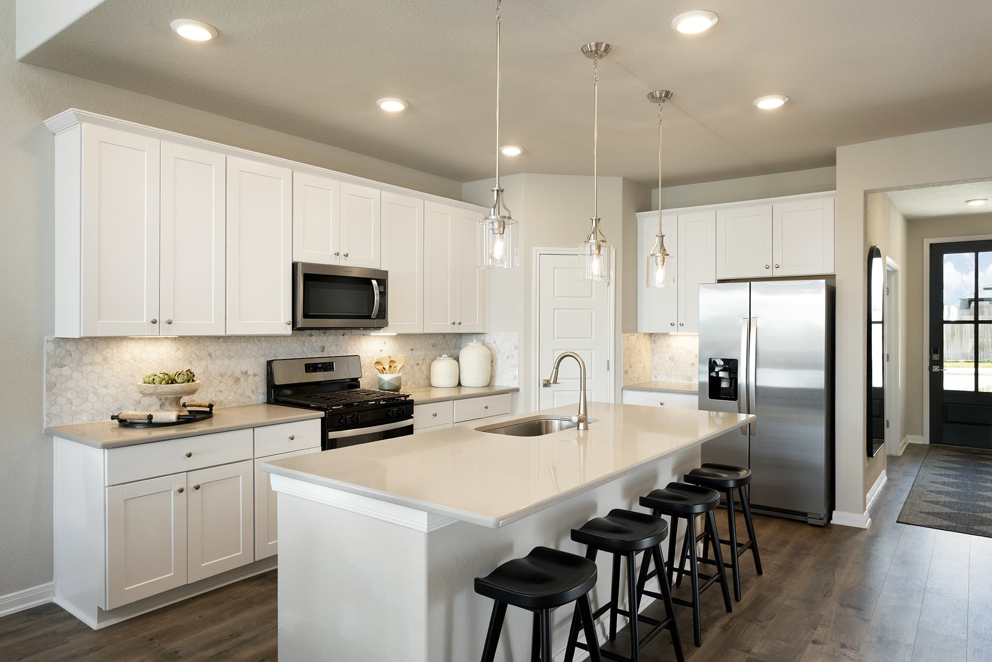 kitchen with white countertops & cabinets