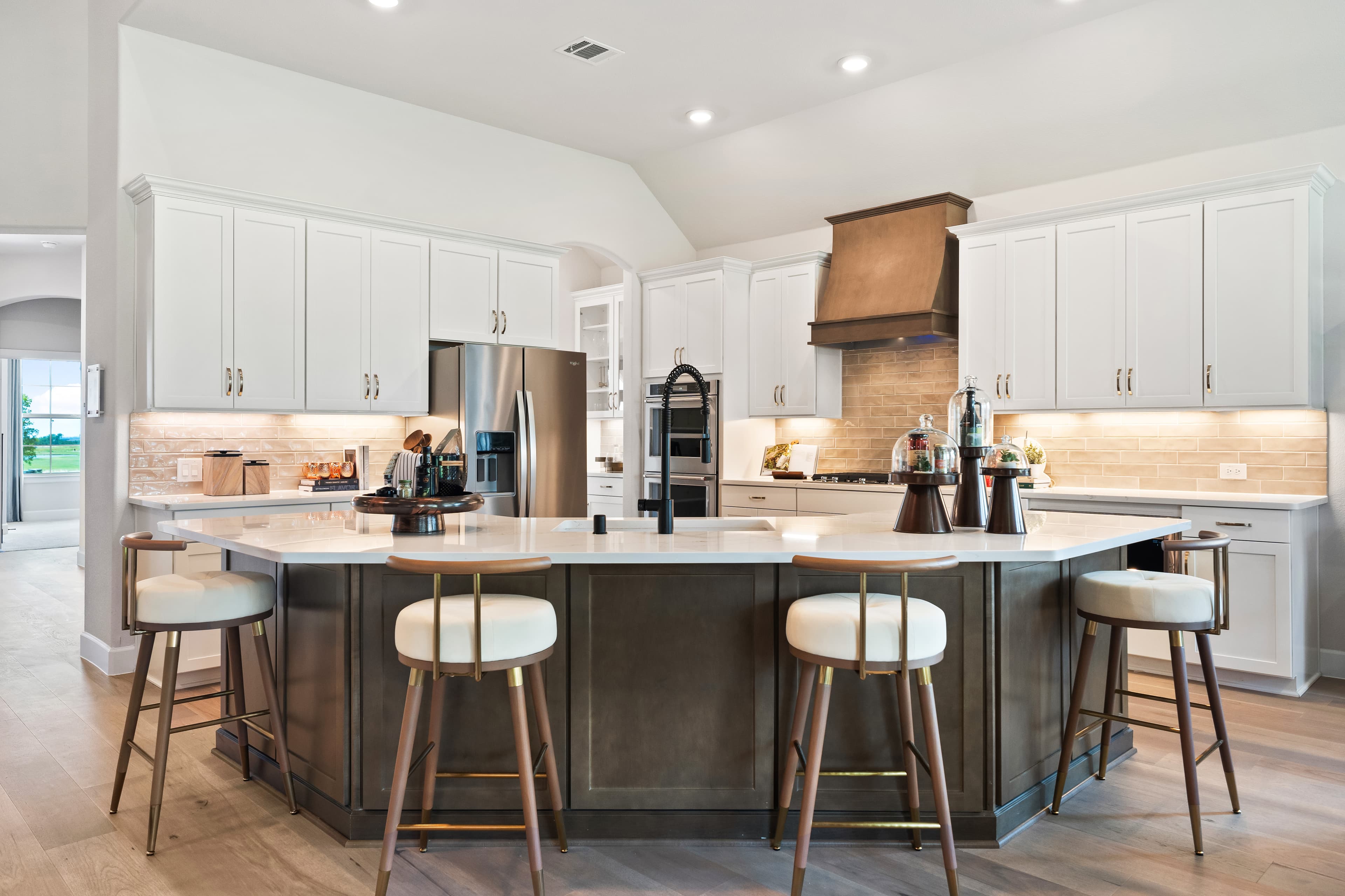 open kitchen with white cabinets and large island