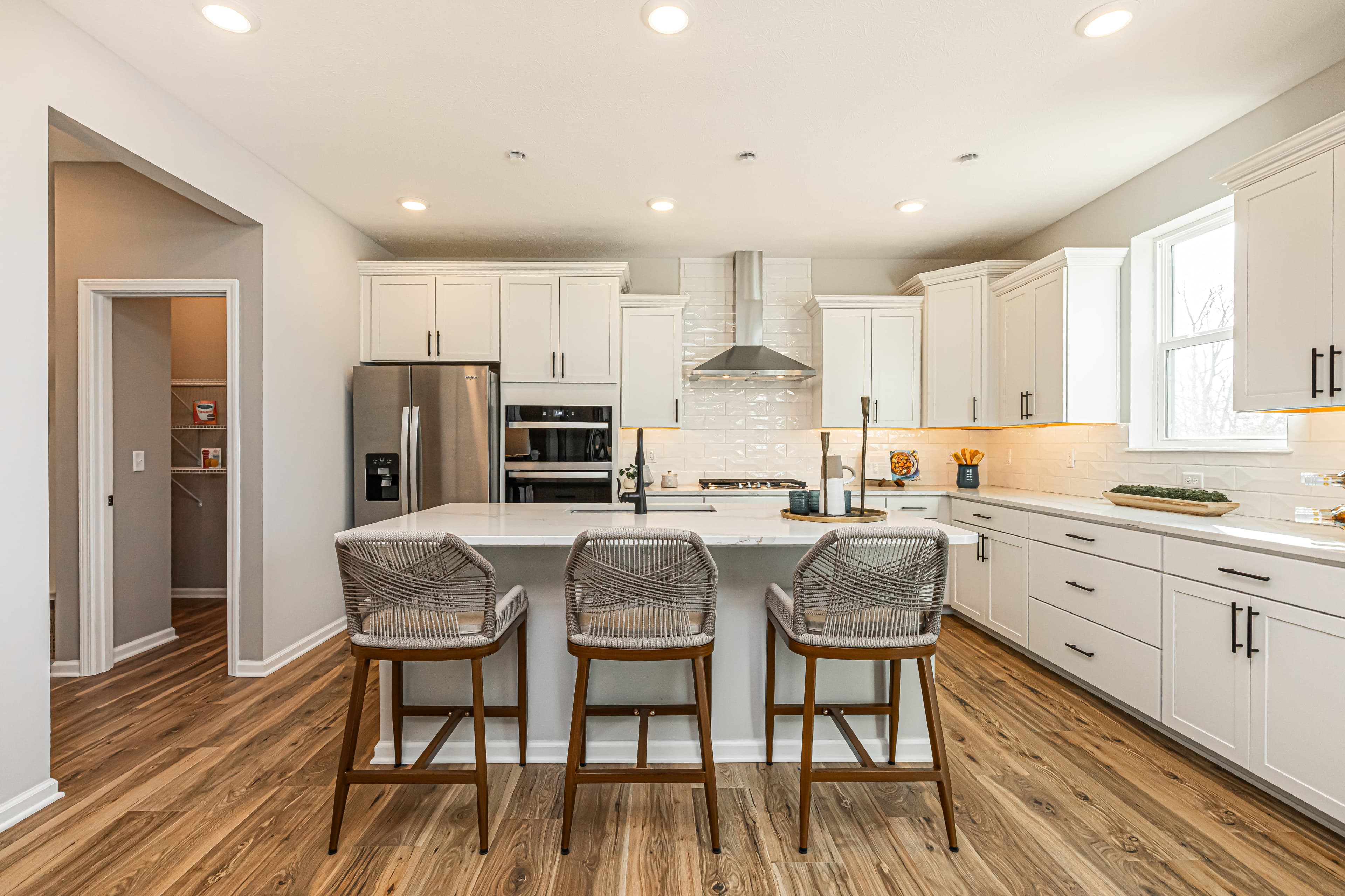 kitchen with white cabinets and spacious island 