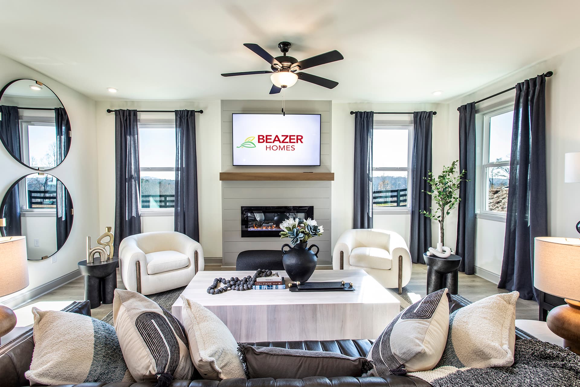 great room with shiplap fireplace and windows
