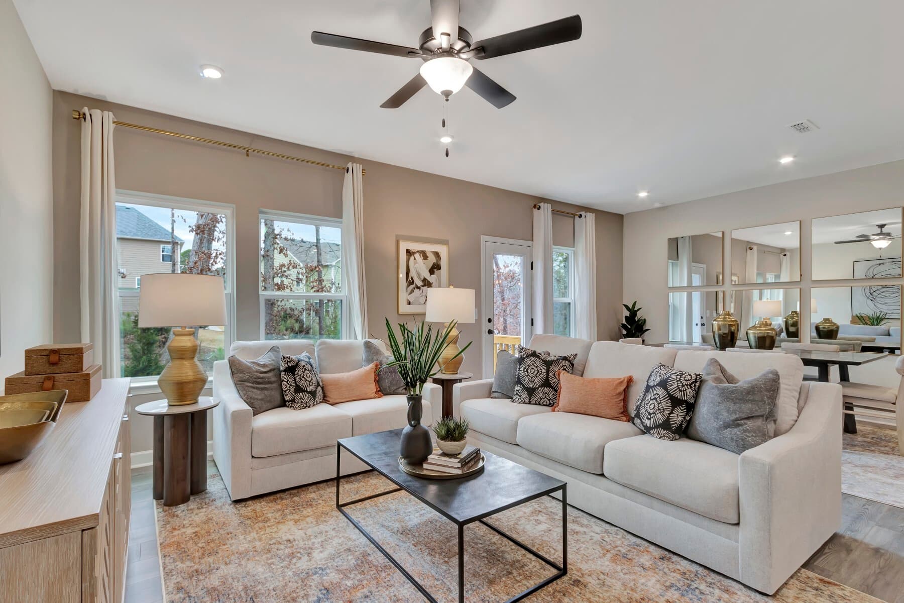 room with two couches and wood floors