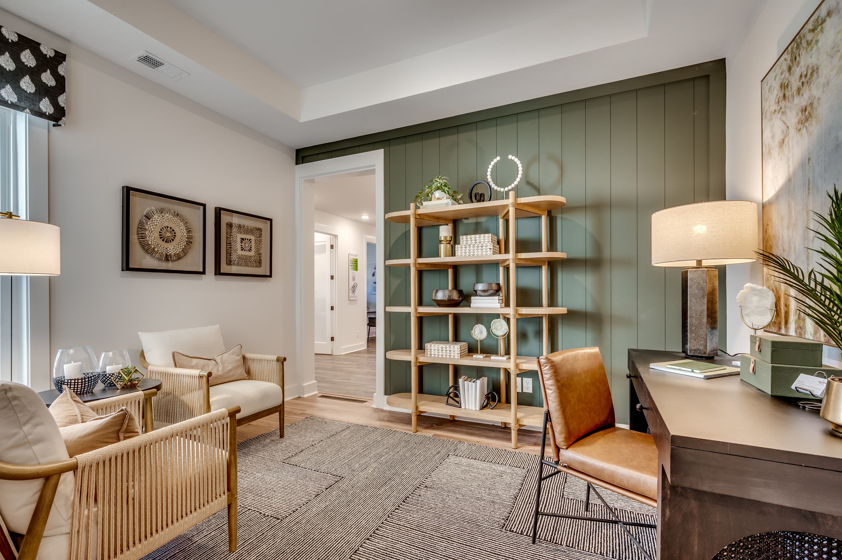 green accent wall with neutral colored furniture 