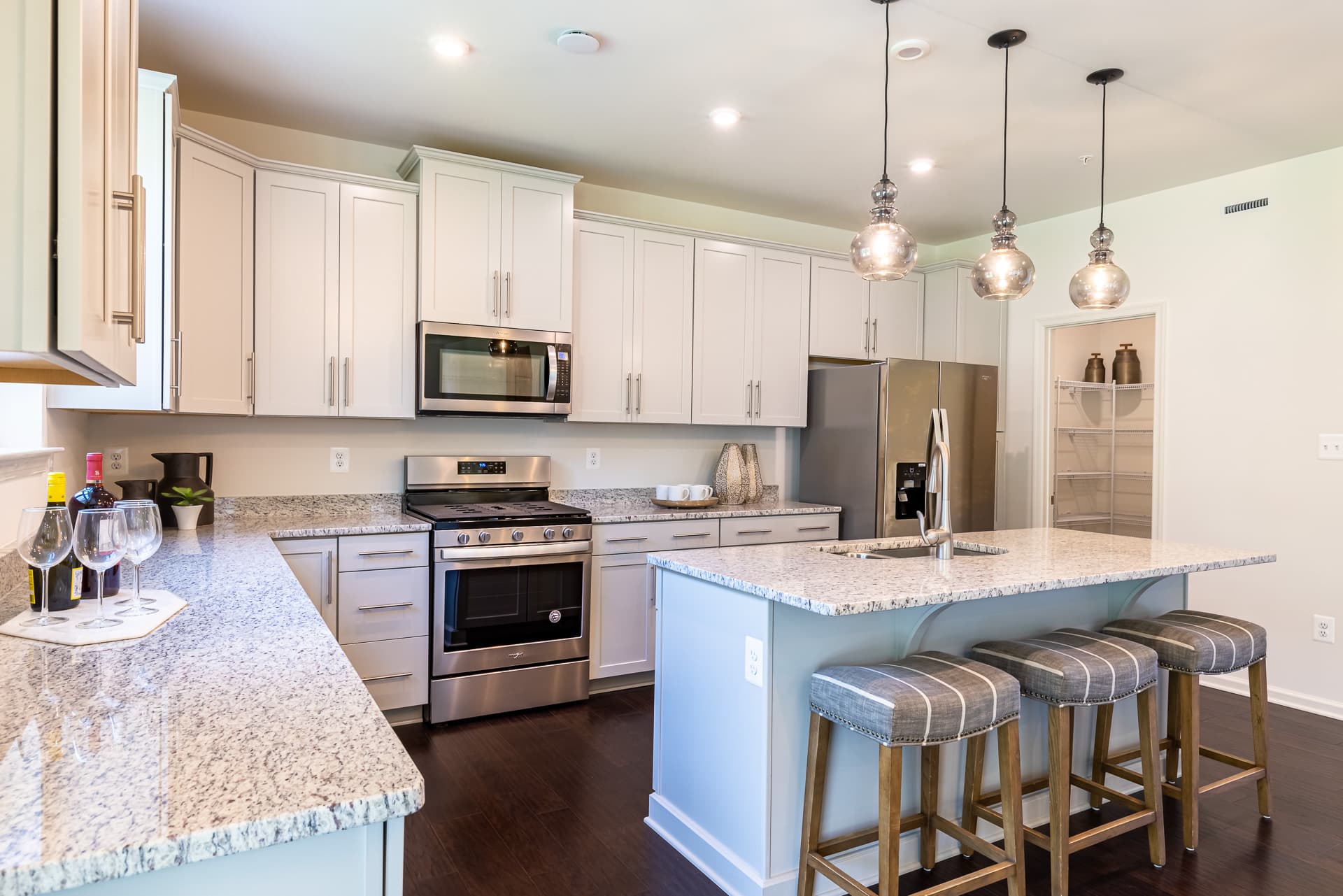 kitchen in white with stainless steel appliances