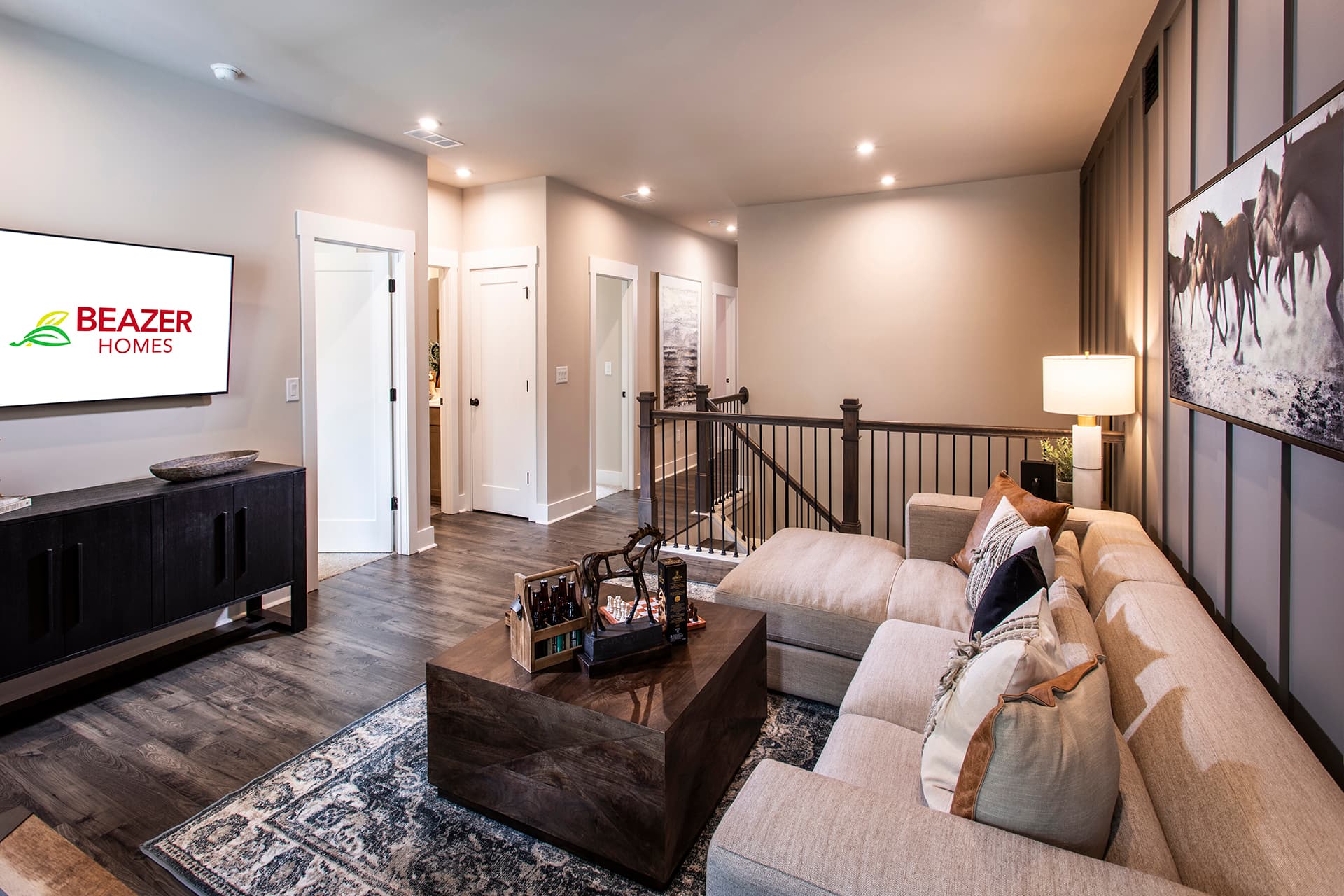loft with plank flooring & wainscoting wall 